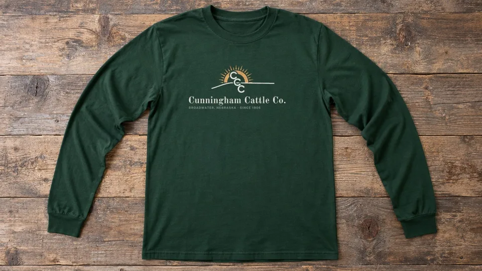 Dark green long-sleeve tee with the Cunningham Cattle Co. logo